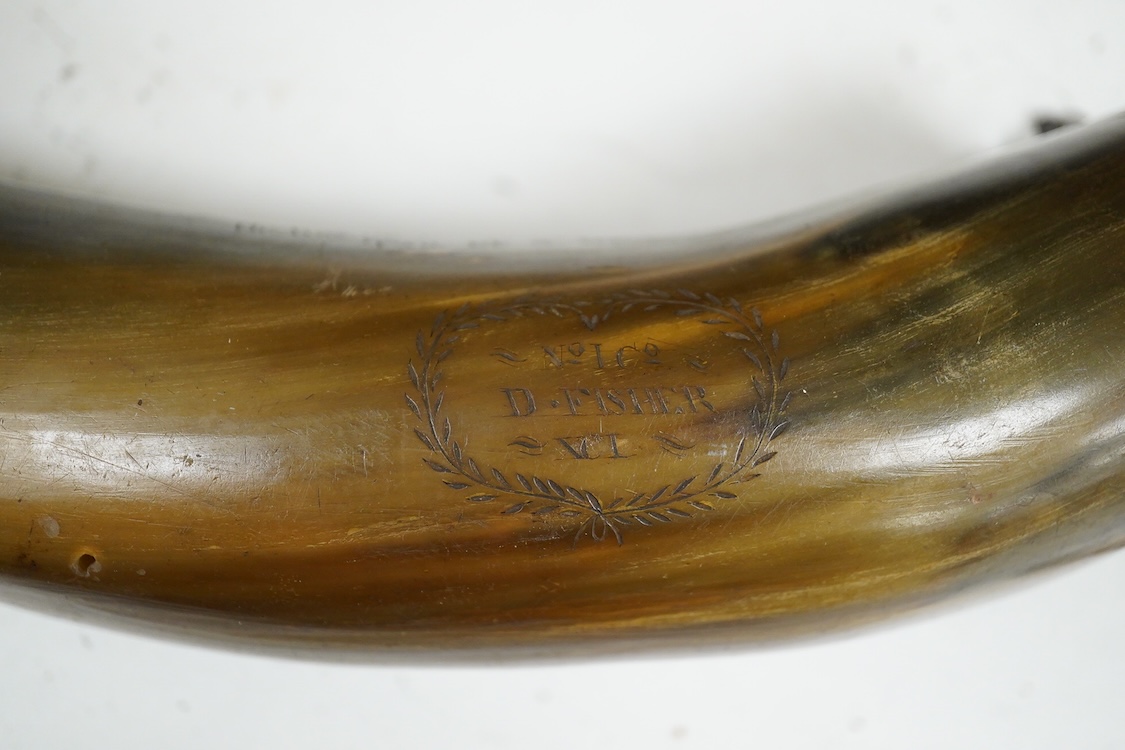 Two scrimshaw engraved cowhorn flasks the first engraved with ships, plants, fish, an anchor, a watering can and various other implements, the second engraved with a Scottish sentimental verse and the owner’s name; D. Fi